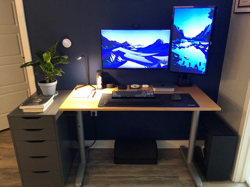 Programmer desk setup with laptop and external monitor