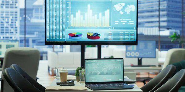AI powered office scene with data analytics screens
