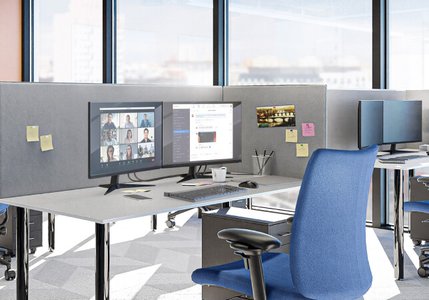 modern office workspace with technology and data screens