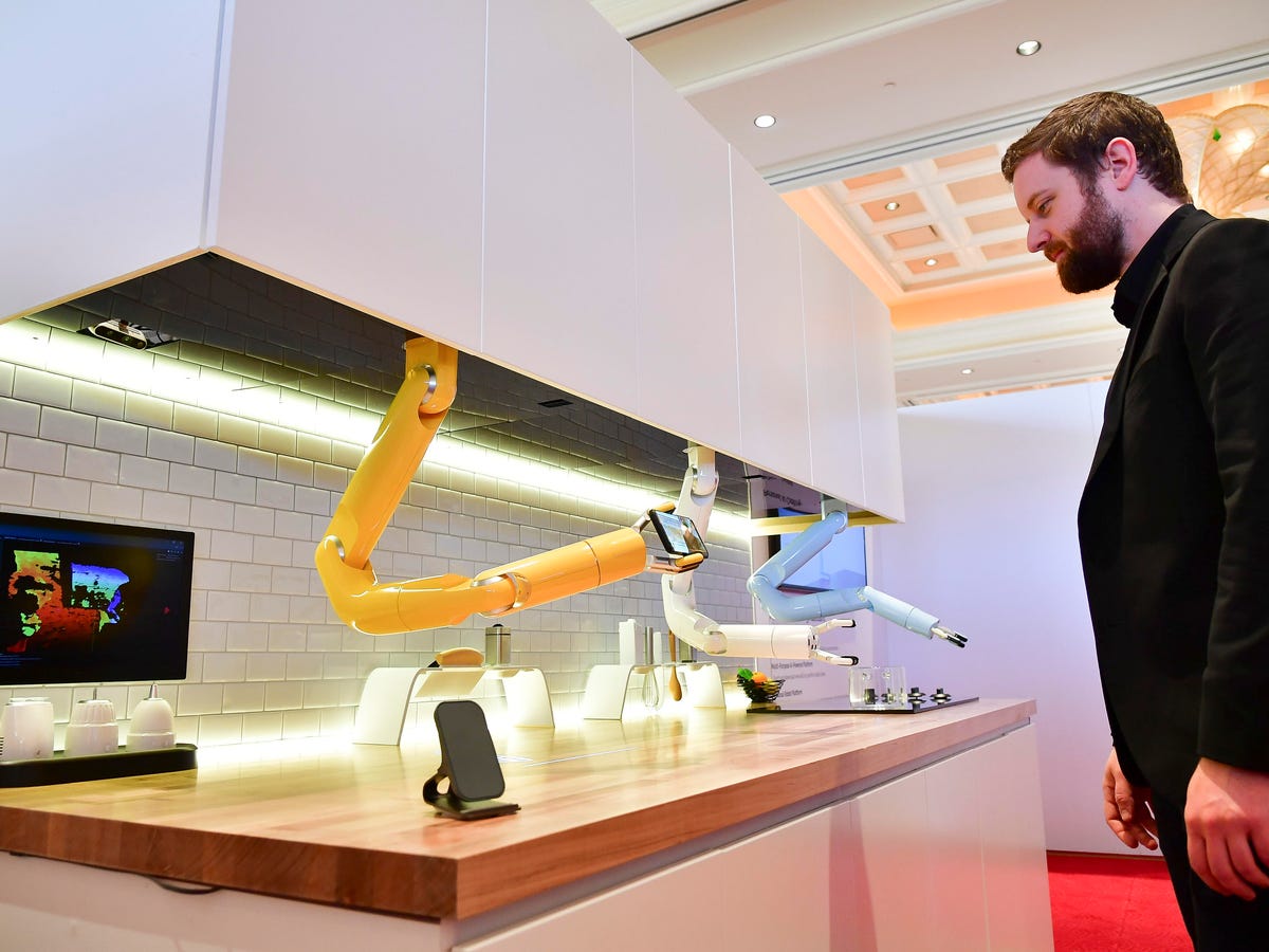 modern kitchen with cooking robots and creative writing workspace