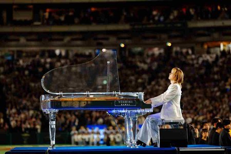 performing pianist on stage with elegant lighting