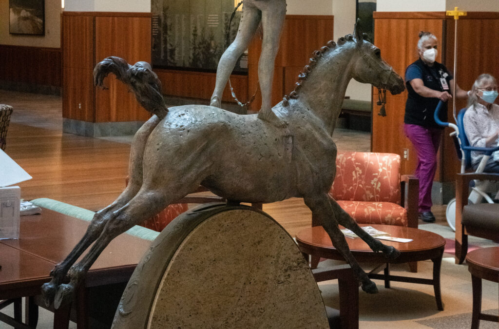 historical statues, urban hospital scene, competitive athletic arena