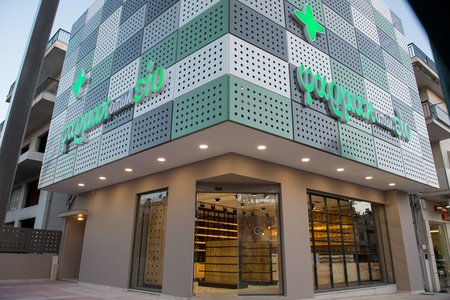 modern pharmacy storefront in urban setting