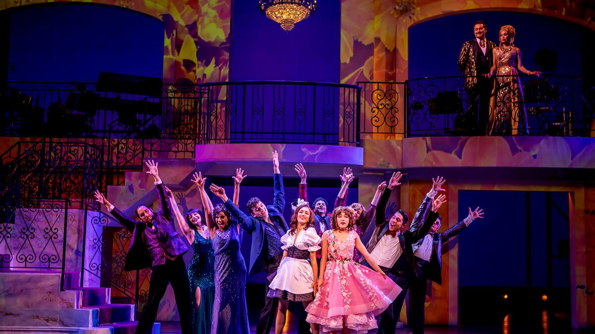 children performing on stage in a colorful telenovela set