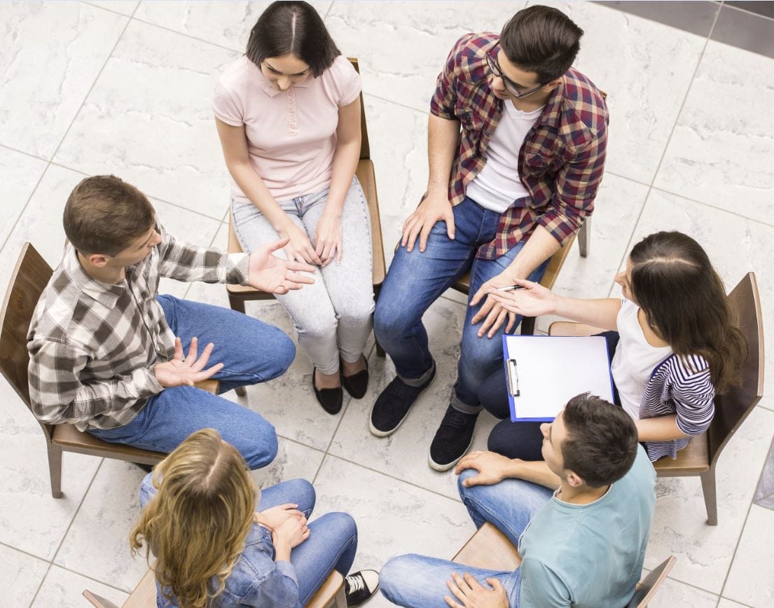 young people in group therapy session