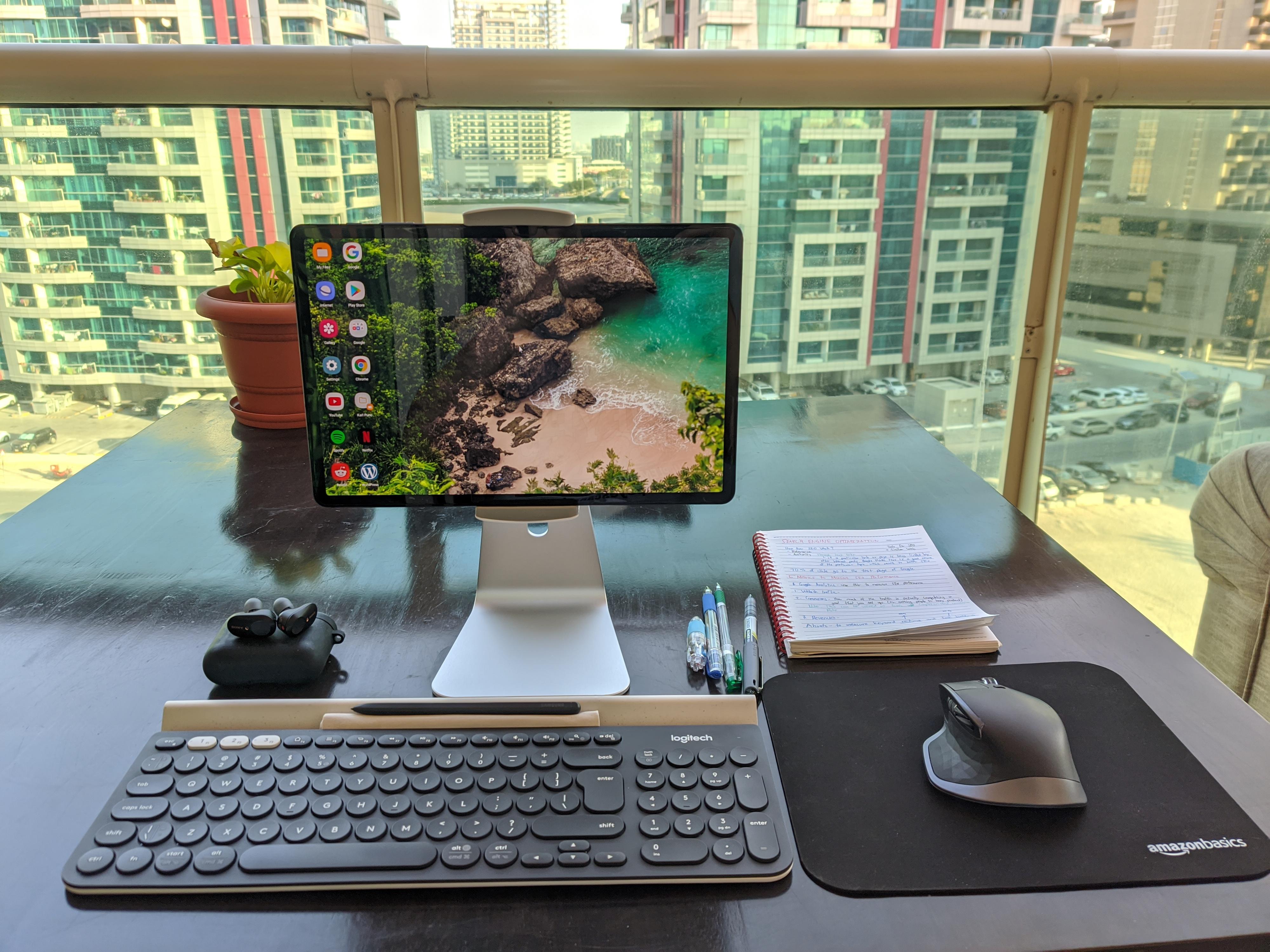 scenic tablet on desk with notes