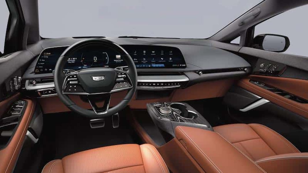 A look at a contemporary luxury SUV interior, highlighting digital screens and modern controls.