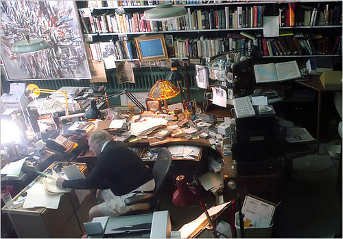 stormy abandoned study desk with papers
