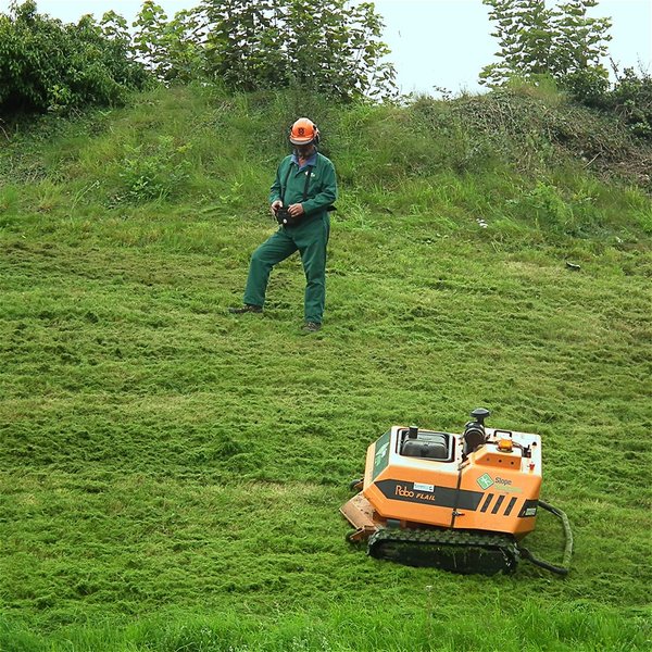 Remote controlled mower operating on a steep slope