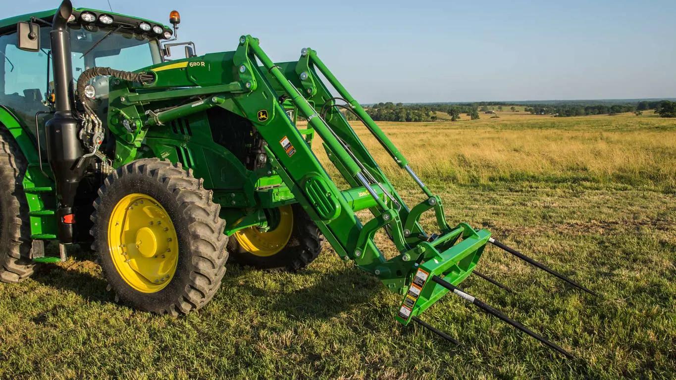 tractor in field with visible dimensions and loader