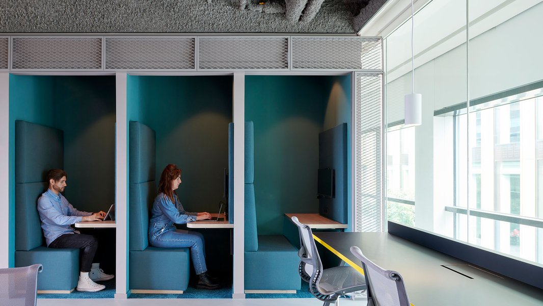 Modern office focus pod providing a quiet space for individual work.