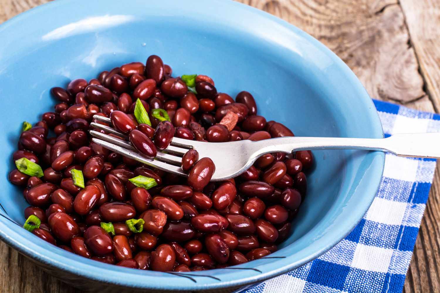 various beans on wooden table