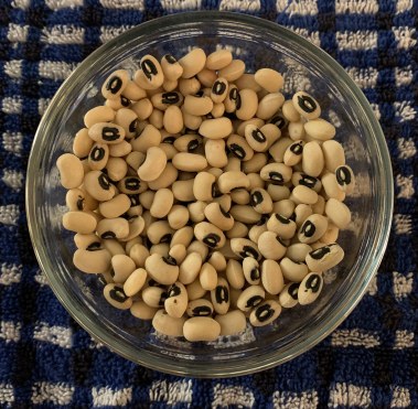 dried beans and peas on a rustic kitchen table