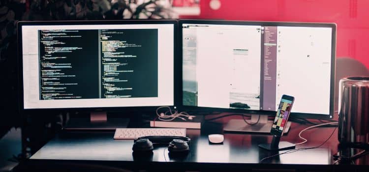 coding workspace computer screens with code