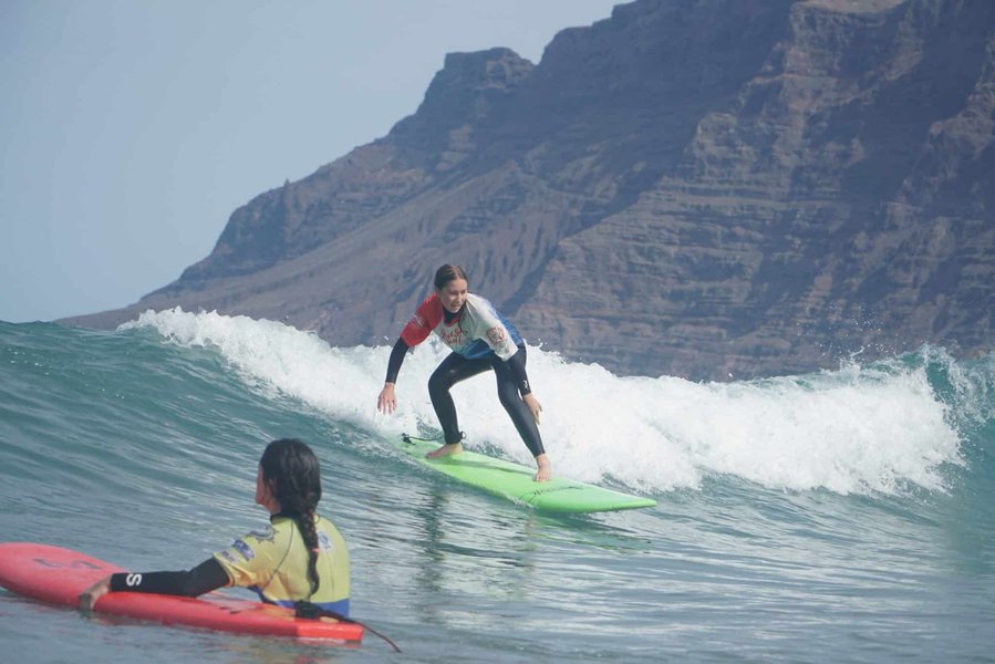 Surfer riding a wave at Famara Beach