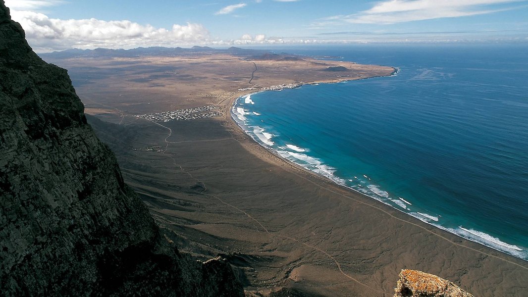 Aerial view of a powerful reef break in Lanzarote