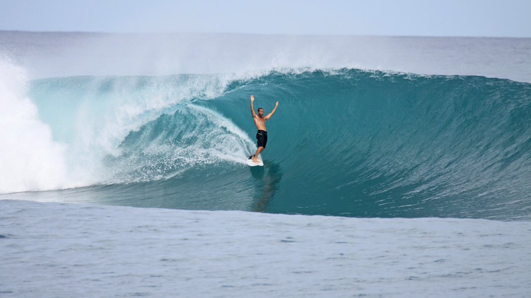 Surfer riding a wave at La Santa, Lanzarote