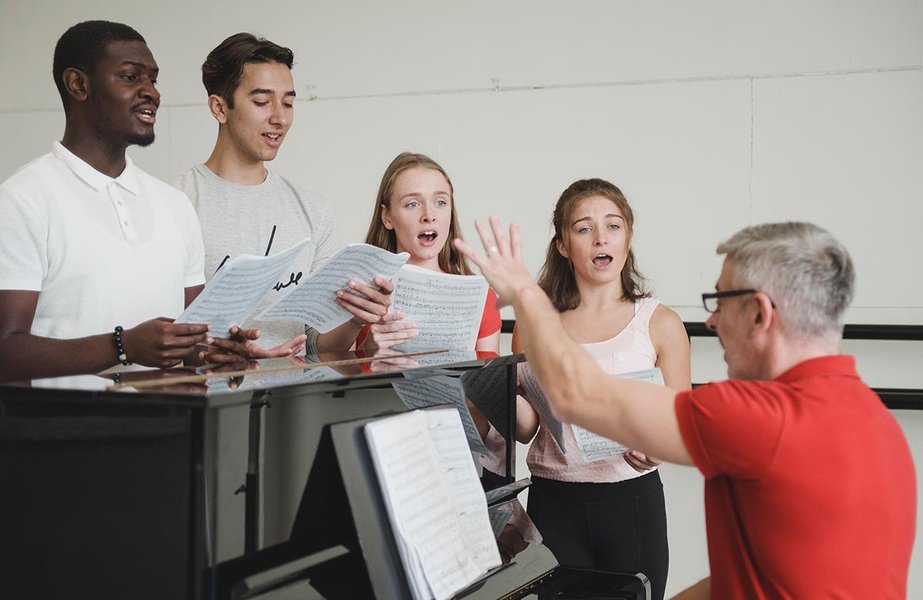Students participating in a singing class or workshop