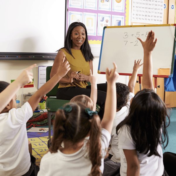 Students engaged in a collaborative math activity in a classroom