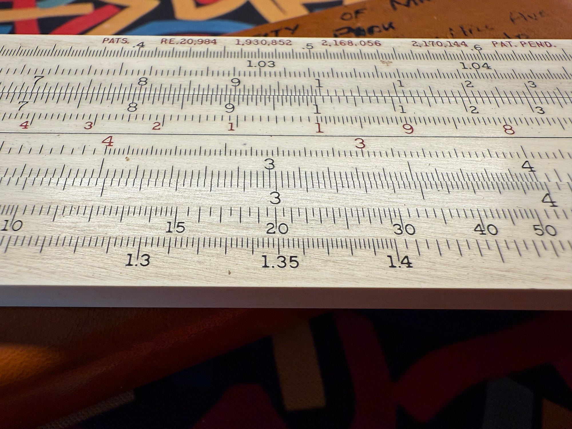 mathematical equations on paper and printed scales