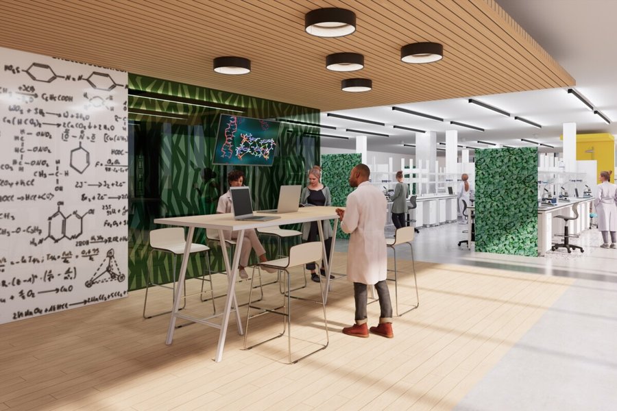 Modern biotech laboratory with scientists collaborating