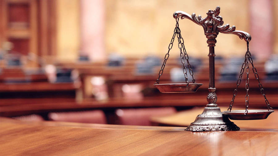 legal books and courtroom scales