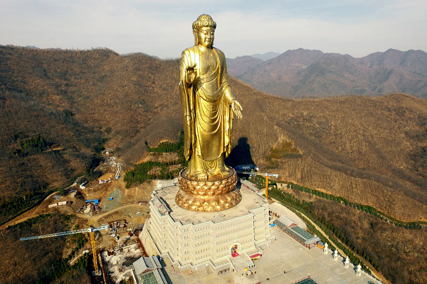 Bodhisattva statue and Buddhist temple