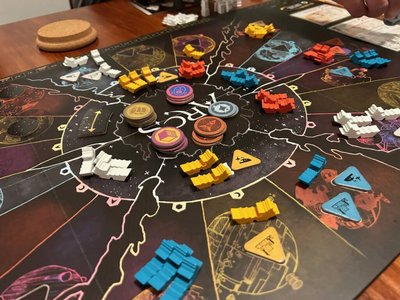 industrial era factories and strategic board game pieces