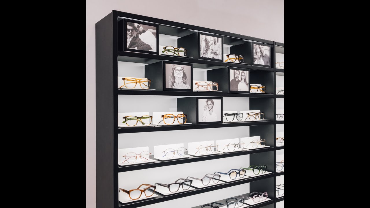 modern eyeglass frames on display shelf