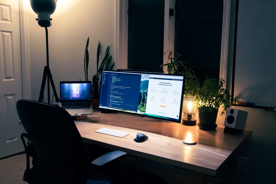 Cozy nighttime coding setup with ambient lighting