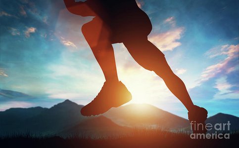 sunrise over mountain with person running