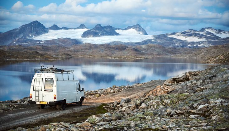 buscamper parked on scenic european road