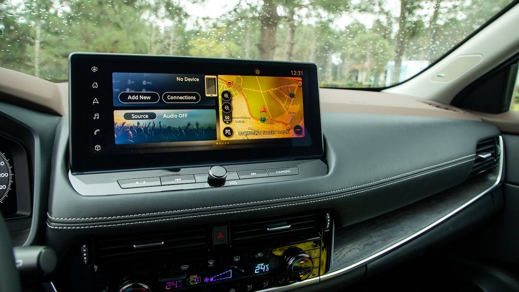 Modern infotainment systems blend navigation, entertainment, and vehicle controls into one central display.