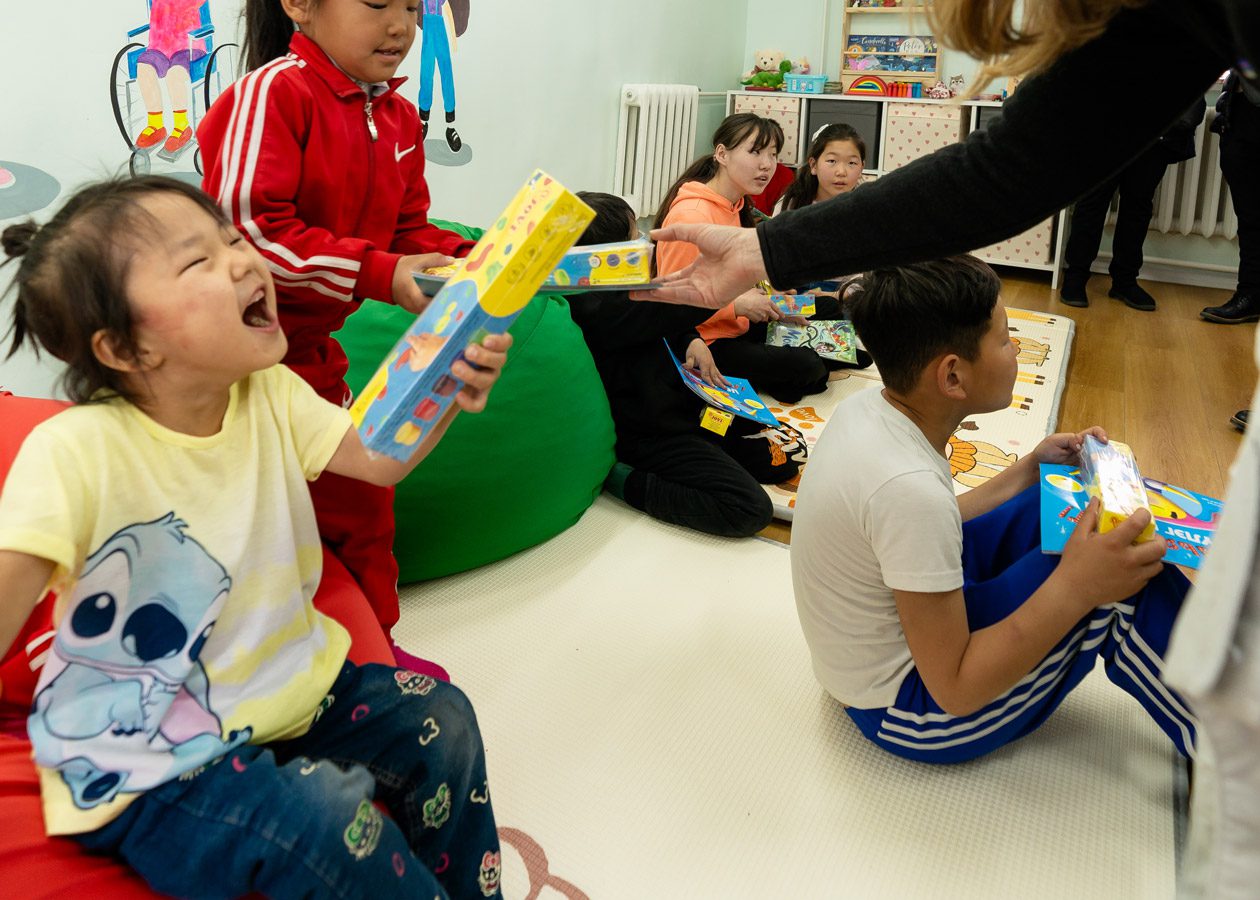 children orphanage joyful caregiver