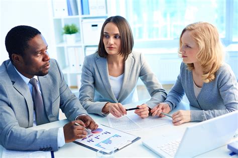 CEO interacting with employees at workplace