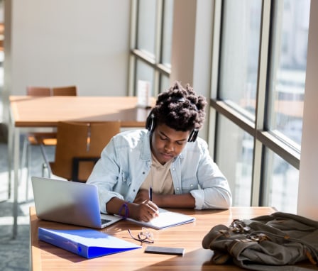 university students with computers and ai tools