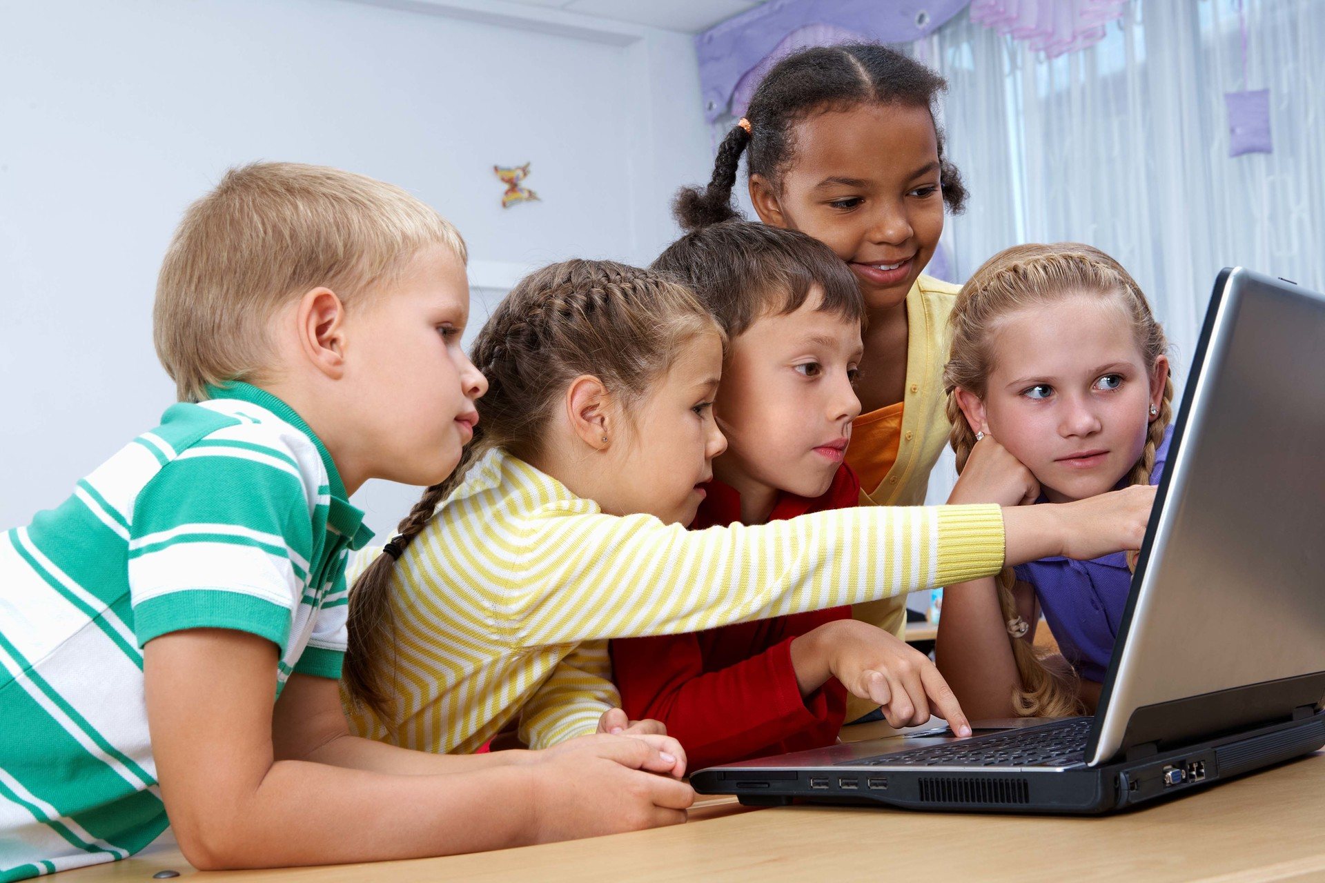 students in ict classroom using computers