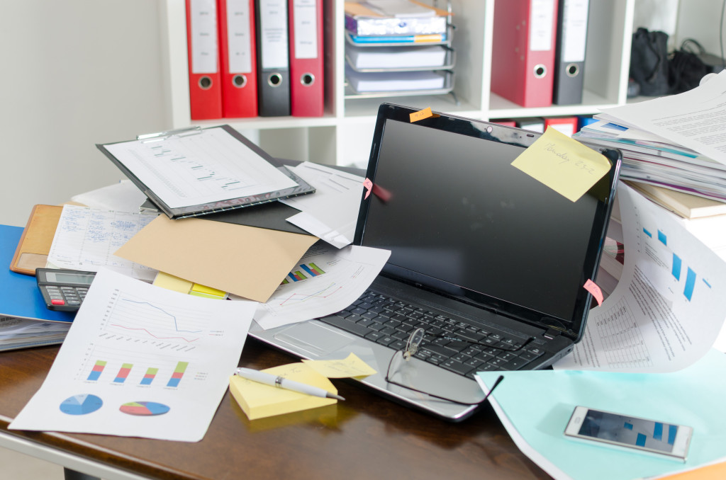 research desk with papers and laptop