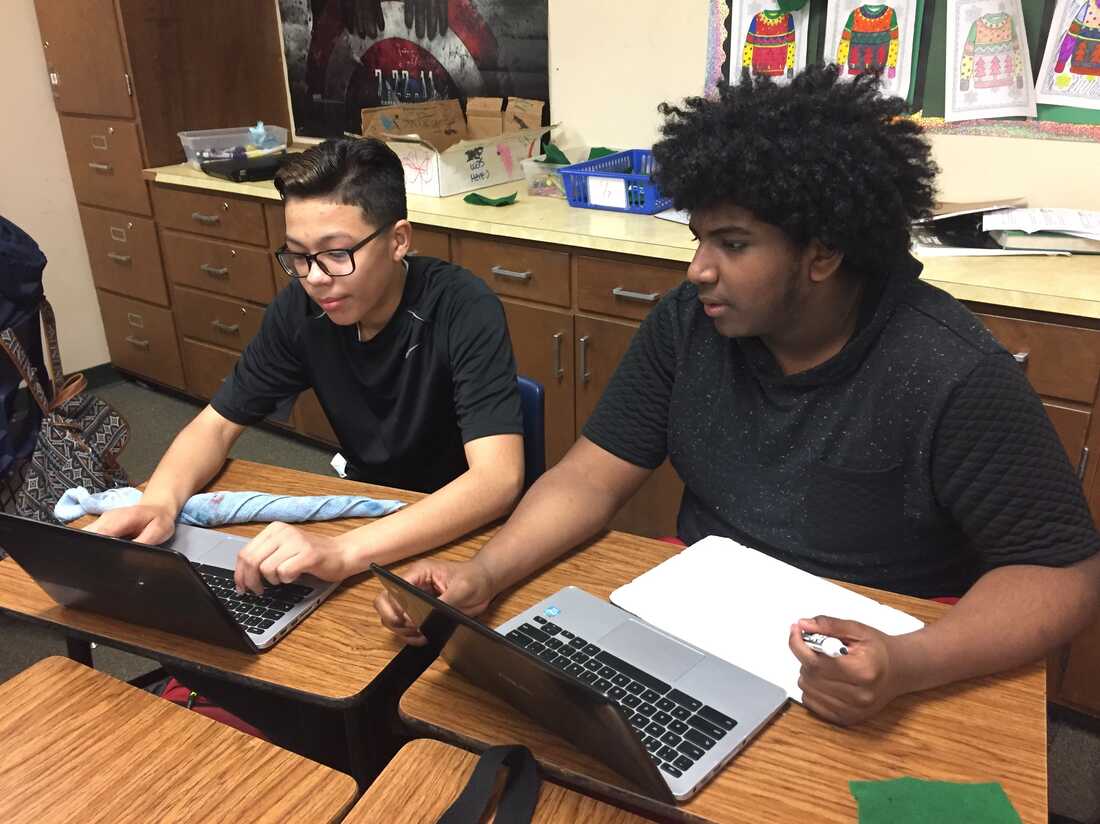 educational building with students using laptops