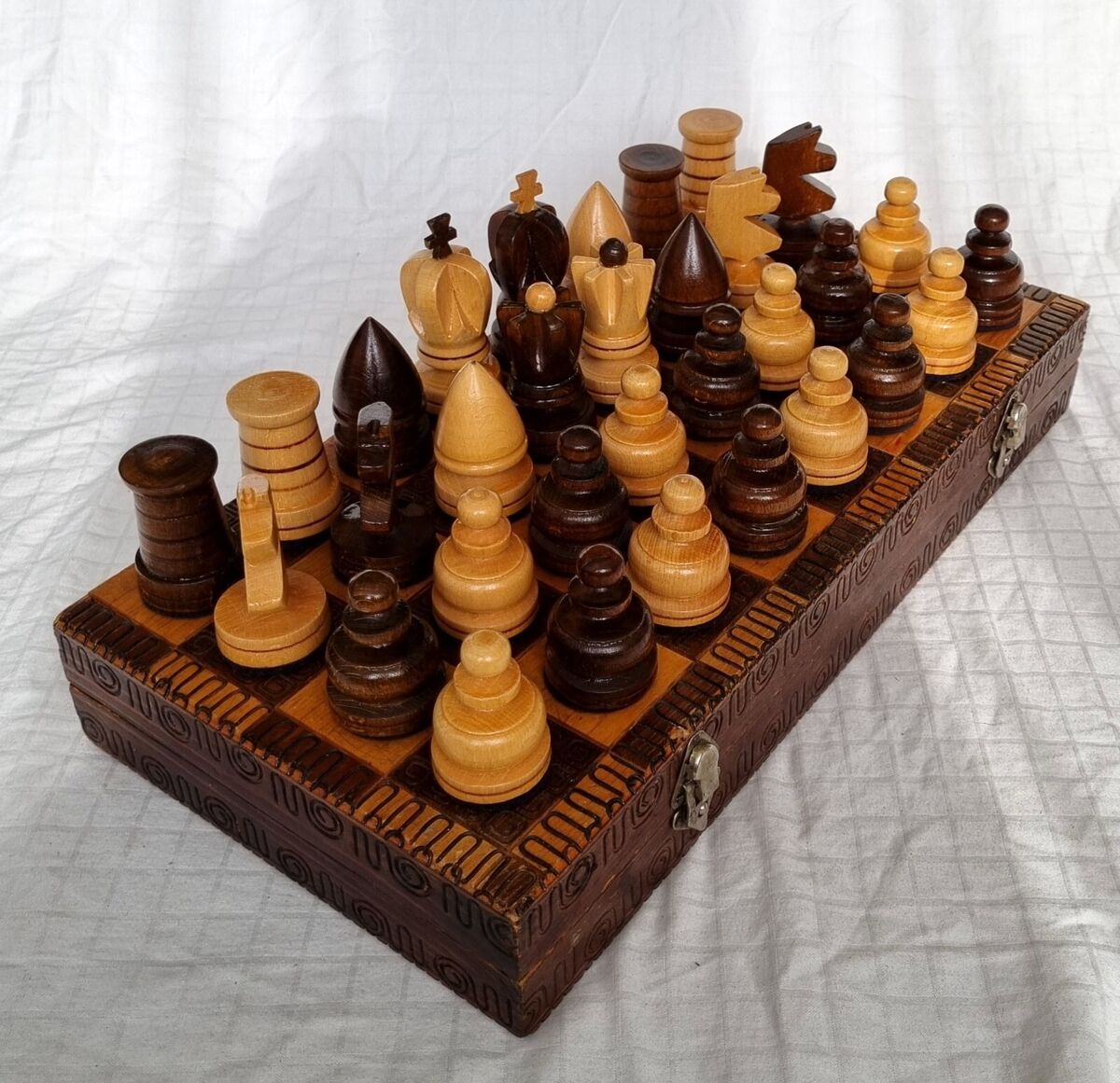 vintage chess pieces on wooden board