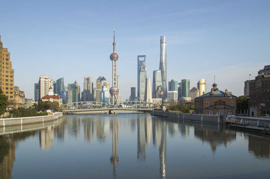 urban skyline and construction cranes in Chinese city