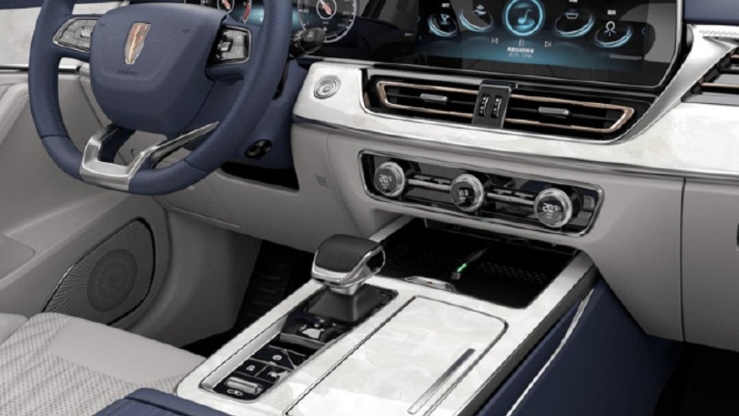 Interior view of a modern Chinese car, potentially similar to the IM L7, showing a minimalist dashboard with large screens and potentially touch-sensitive controls.