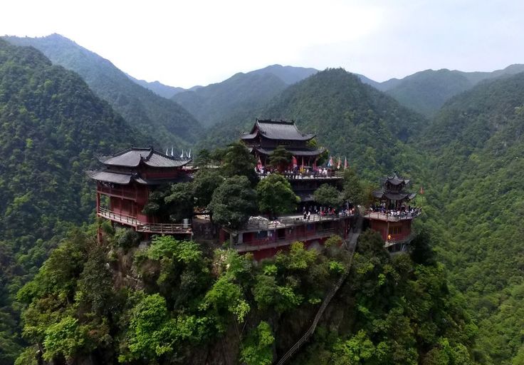 mountainous chinese landscape with traditional architecture