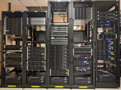 server room with computers and data charts