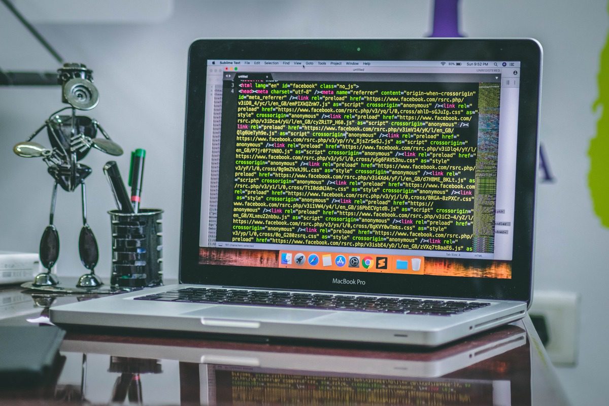 scenic view of computer desk with coding books