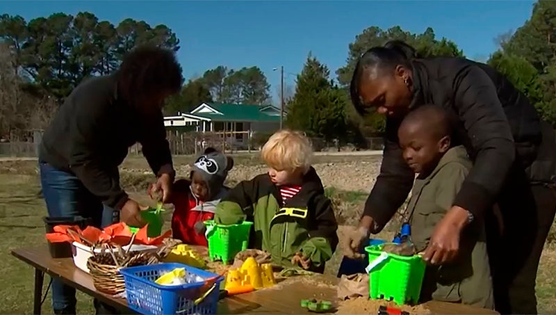 children playing outdoors with educational toys