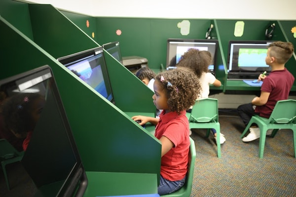 children playing learning environment technology classroom