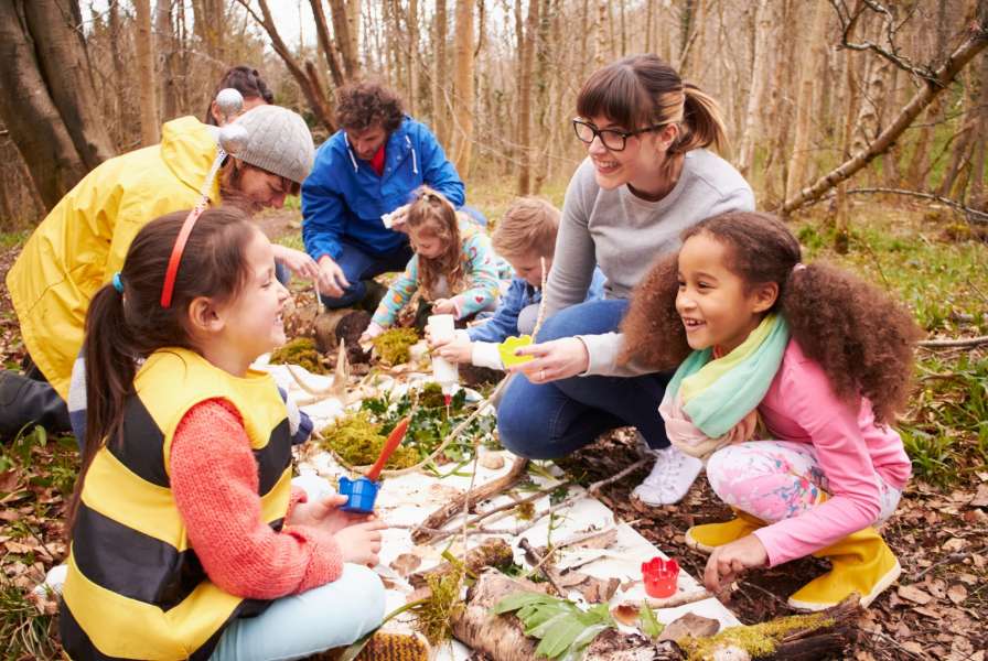 children playing outdoors learning