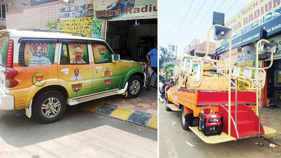 vehicles decorated with political campaign decals on busy urban streets