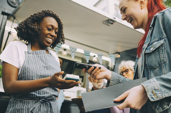 smiling customer service representative interacting with client
